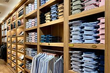Wall of colour-sorted Bexley shirts – Bilbao shop interior