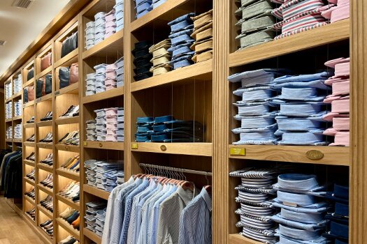 Wall of colour-sorted Bexley shirts – Bilbao shop interior
