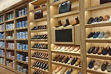 Men's shirts, bags and shoes display at Bexley store