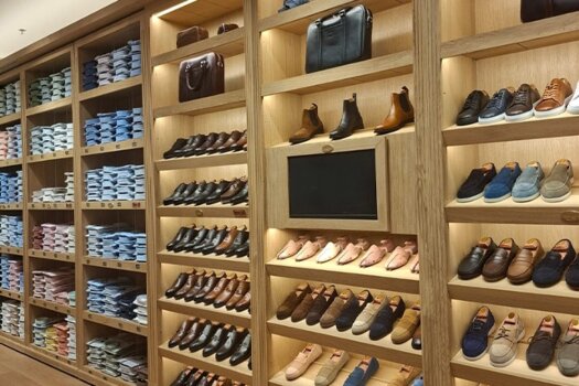 Men's shirts, bags and shoes display at Bexley store