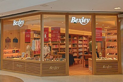 Front of the Bexley store with bright window displays showcasing shoes and clothing.