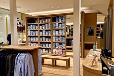 Spacious interior of the Bexley store at Val d’Europe – Neatly arranged shirt shelves