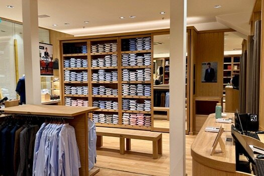 Spacious interior of the Bexley store at Val d’Europe – Neatly arranged shirt shelves