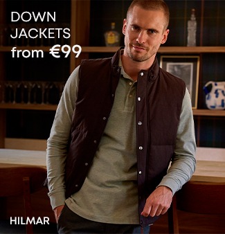 Man wearing a brown sleeveless padded jacket over a green polo shirt