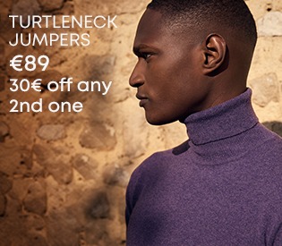 Man wearing a purple turtleneck pullover