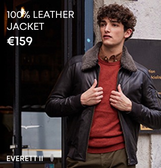 Man wearing a 100% leather jacket with shearling collar in an urban look