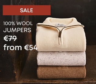 Stack of wool jumpers, zipped and classic styles on promotion.