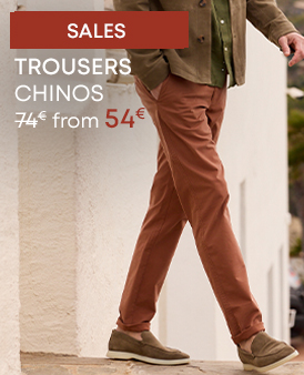 Man wearing rust-coloured chino trousers – from €54