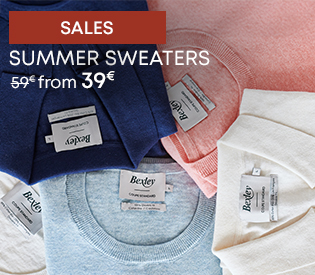 Folded summer sweaters in pastel colours