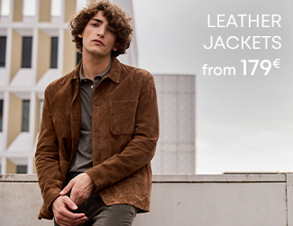 Man wearing a brown suede jacket over a dark polo