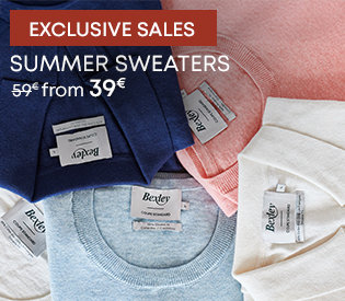 Folded summer sweaters in pastel colours