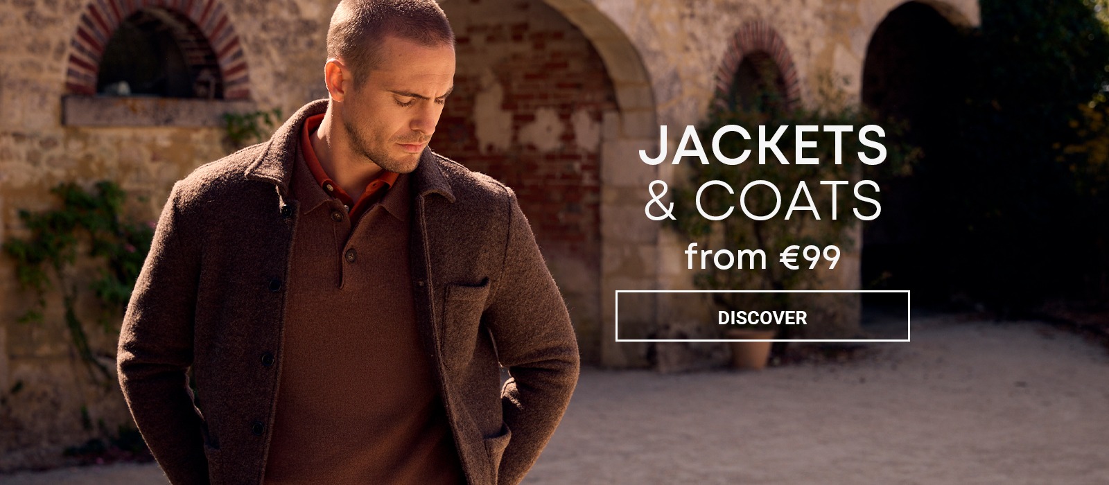 Man wearing a brown jacket over a matching jumper