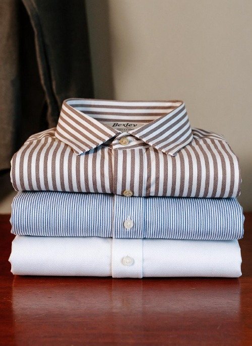 Plain and striped men's shirts in white, blue and brown