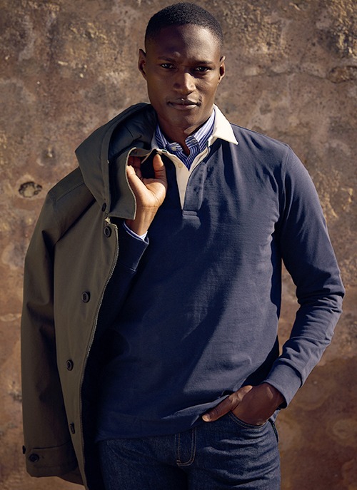 Man wearing a long-sleeve navy polo shirt