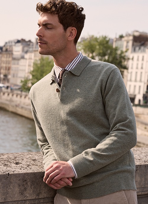 Man wearing a green long-sleeve polo pullover