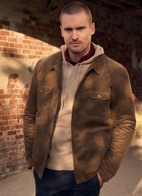 Man wearing a brown corduroy jacket
