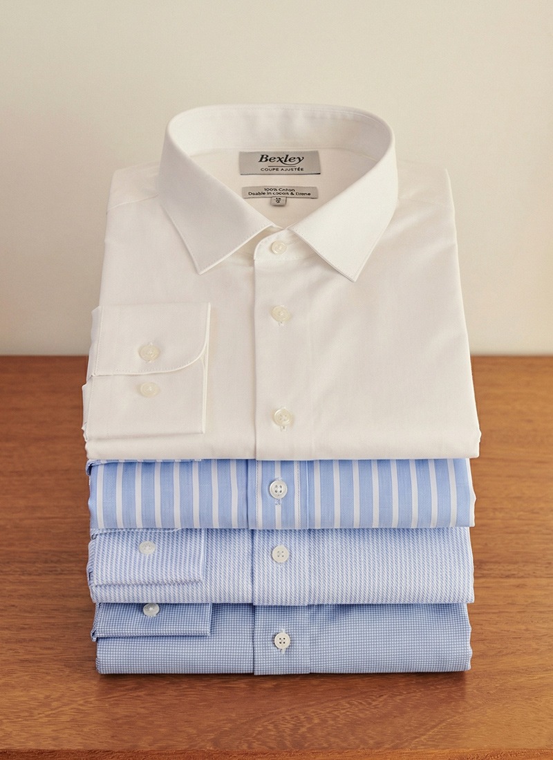 Colourful linen shirts on hangers – -50% offer