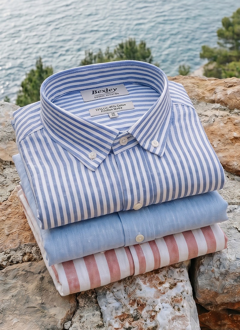 Stack of men's striped and plain cotton-linen shirts