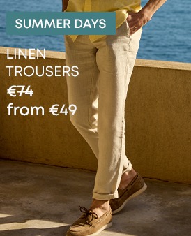 Man wearing beige linen trousers with loafers, an elegant summer outfit