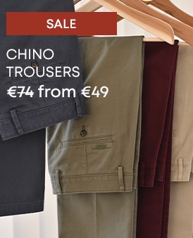 Men’s chinos in multiple colours displayed on hangers